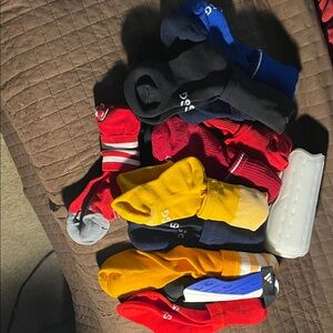 Mix brands bulk Athletic Crew Socks in Red, Yellow, Blue & Black